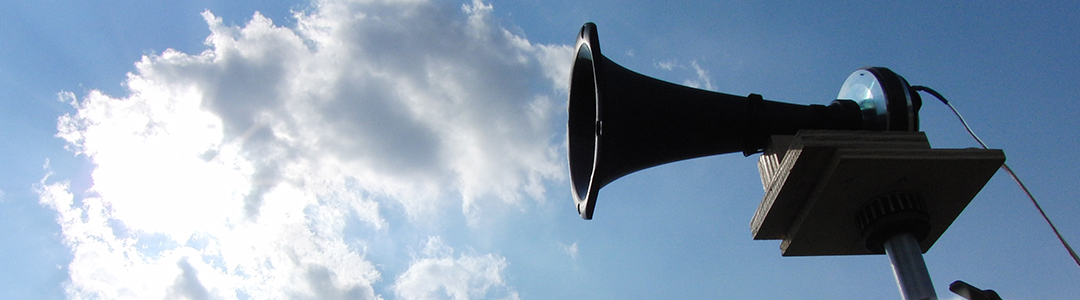 A loud speaker against the sky. 